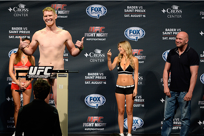 BANGOR, ME - AUG 15: (L-R) Sam Alvey steps on the scale as UFC President Dana White reacts during the UFC fight night weigh-in at the Cross Insurance Center on August 15, 2014 in Bangor, Maine. (Photo by Jeff Bottari/Zuffa LLC/Zuffa LLC via Getty Images)