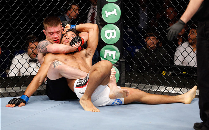 BERLIN, GERMANY - MAY 31: Maximo Blanco (R) fights Andy Ogle during the Maximo Blanco vs. Andy Ogle at UFC Fight Night Berlin event at O2 World on May 31, 2014 in Berlin, Germany. (Photo by Boris Streubel/Zuffa LLC/Zuffa LLC via Getty Images)