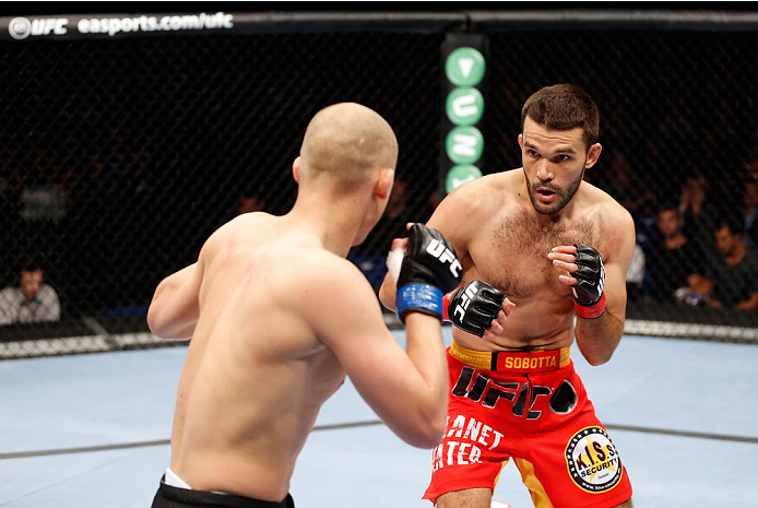 BERLIN, GERMANY - MAY 31: Pawel Pawlak (L) fights Peter Sobotta during the Pawel Pawlak vs. Peter Sobotta at UFC Fight Night Berlin event at O2 World on May 31, 2014 in Berlin, Germany. (Photo by Boris Streubel/Zuffa LLC/Zuffa LLC via Getty Images)