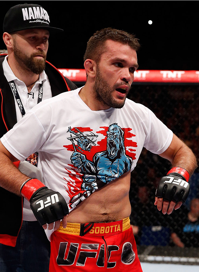 BERLIN, GERMANY - MAY 31: Peter Sobotta puts on his shirt after winning the Pawel Pawlak vs. Peter Sobotta at UFC Fight Night Berlin event at O2 World on May 31, 2014 in Berlin, Germany. (Photo by Boris Streubel/Zuffa LLC/Zuffa LLC via Getty Images)