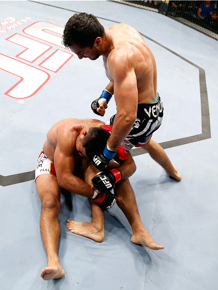 BERLIN, GERMANY - MAY 31: Gegard Mousasi (R) fights Mark Munoz during the Gegard Mousasi vs. Mark Munoz match at UFC Fight Night Berlin event at O2 World on May 31, 2014 in Berlin, Germany. (Photo by Boris Streubel/Zuffa LLC/Zuffa LLC via Getty Images)