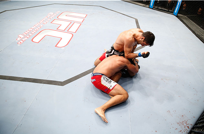 BERLIN, GERMANY - MAY 31: Gegard Mousasi (R) fights Mark Munoz during the Gegard Mousasi vs. Mark Munoz match at UFC Fight Night Berlin event at O2 World on May 31, 2014 in Berlin, Germany. (Photo by Boris Streubel/Zuffa LLC/Zuffa LLC via Getty Images)