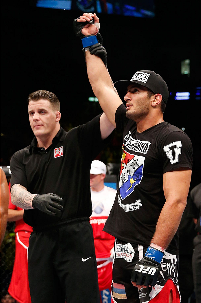 BERLIN, GERMANY - MAY 31: Gegard Mousasi (R) celebrates after winning the Gegard Mousasi vs. Mark Munoz match at UFC Fight Night Berlin event at O2 World on May 31, 2014 in Berlin, Germany. (Photo by Boris Streubel/Zuffa LLC/Zuffa LLC via Getty Images)