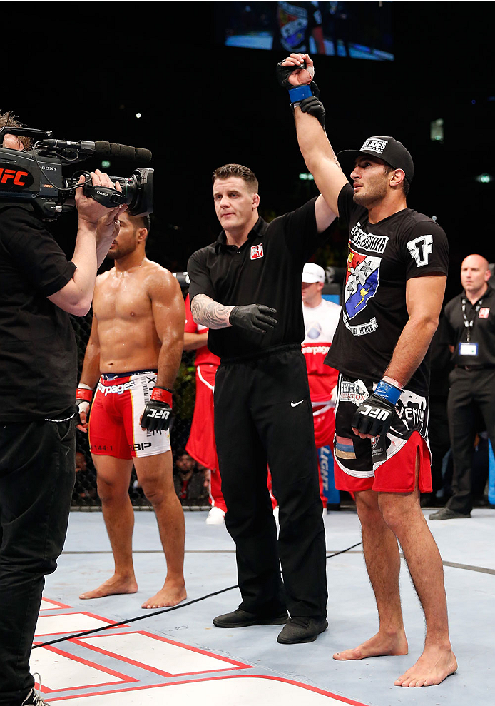 BERLIN, GERMANY - MAY 31: Gegard Mousasi (R) celebrates after winning the Gegard Mousasi vs. Mark Munoz match at UFC Fight Night Berlin event at O2 World on May 31, 2014 in Berlin, Germany. (Photo by Boris Streubel/Zuffa LLC/Zuffa LLC via Getty Images)