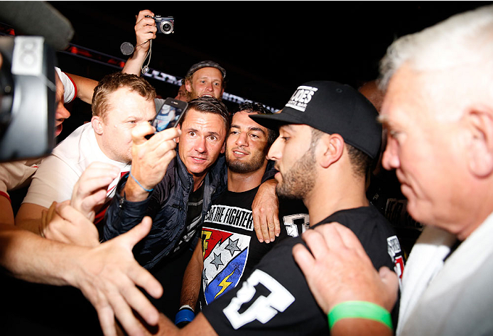 BERLIN, GERMANY - MAY 31: Gegard Mousasi (C) poses with fans after winning the Gegard Mousasi vs. Mark Munoz match at UFC Fight Night Berlin event at O2 World on May 31, 2014 in Berlin, Germany. (Photo by Boris Streubel/Zuffa LLC/Zuffa LLC via Getty Imag