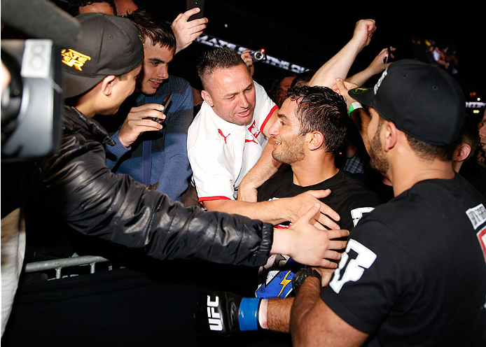 BERLIN, GERMANY - MAY 31: Gegard Mousasi (C) poses with fans after winning the Gegard Mousasi vs. Mark Munoz match at UFC Fight Night Berlin event at O2 World on May 31, 2014 in Berlin, Germany. (Photo by Boris Streubel/Zuffa LLC/Zuffa LLC via Getty Imag