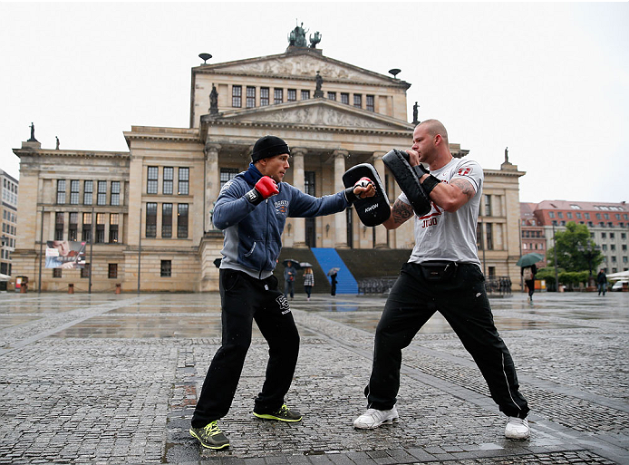 BERLIN, GERMANY - MAY 28: Nick Hein (L) holds a Guerillia open air training session for fans and media at Gendarmenmarkt on May 28, 2014 in Berlin, Germany. (Photo by Boris Streubel/Zuffa LLC/Zuffa LLC via Getty Images)