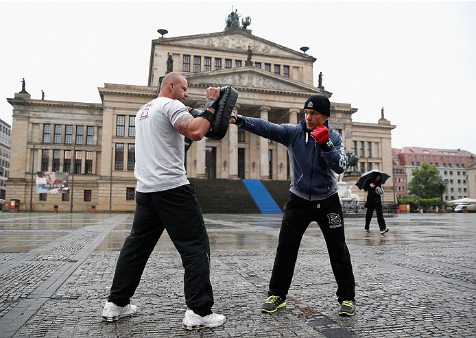 BERLIN, GERMANY - MAY 28: Nick Hein (R) holds a Guerillia open air training session for fans and media at Gendarmenmarkt on May 28, 2014 in Berlin, Germany. (Photo by Boris Streubel/Zuffa LLC/Zuffa LLC via Getty Images)