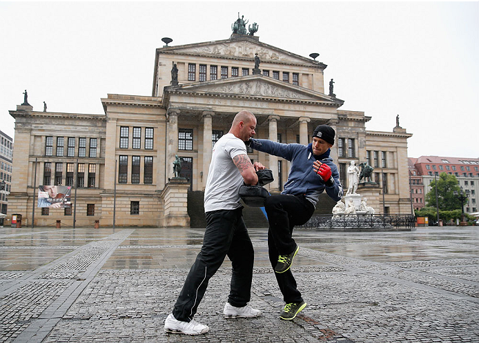BERLIN, GERMANY - MAY 28: Nick Hein (R) holds a Guerillia open air training session for fans and media at Gendarmenmarkt on May 28, 2014 in Berlin, Germany. (Photo by Boris Streubel/Zuffa LLC/Zuffa LLC via Getty Images)