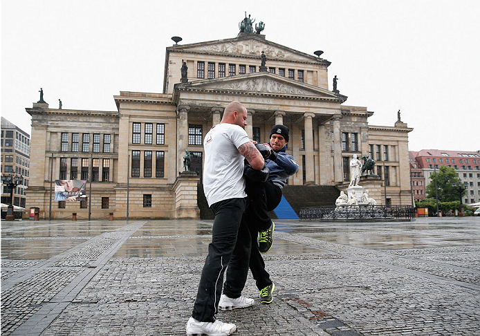 BERLIN, GERMANY - MAY 28: Nick Hein (R) holds a Guerillia open air training session for fans and media at Gendarmenmarkt on May 28, 2014 in Berlin, Germany. (Photo by Boris Streubel/Zuffa LLC/Zuffa LLC via Getty Images)