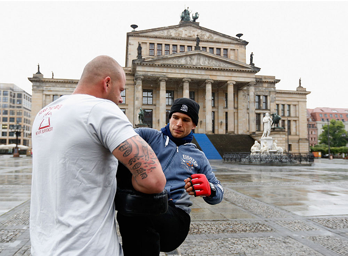 BERLIN, GERMANY - MAY 28: Nick Hein (R) holds a Guerillia open air training session for fans and media at Gendarmenmarkt on May 28, 2014 in Berlin, Germany. (Photo by Boris Streubel/Zuffa LLC/Zuffa LLC via Getty Images)