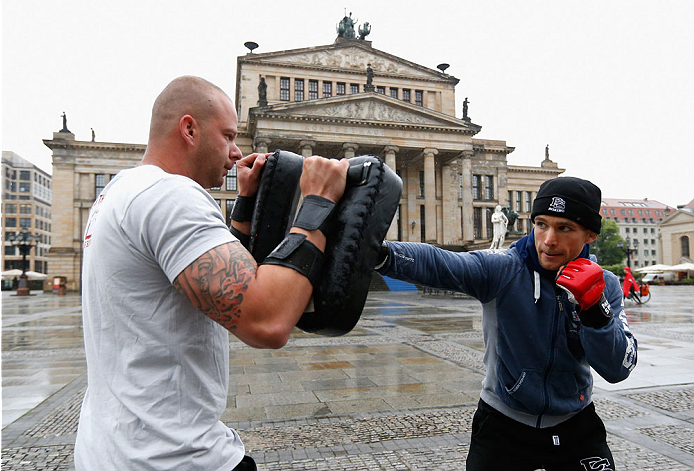 BERLIN, GERMANY - MAY 28: Nick Hein (R) holds a Guerillia open air training session for fans and media at Gendarmenmarkt on May 28, 2014 in Berlin, Germany. (Photo by Boris Streubel/Zuffa LLC/Zuffa LLC via Getty Images)