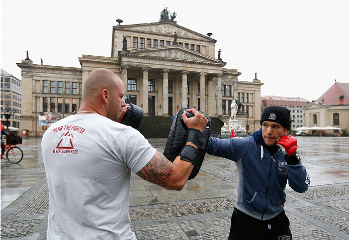 BERLIN, GERMANY - MAY 28: Nick Hein (R) holds a Guerillia open air training session for fans and media at Gendarmenmarkt on May 28, 2014 in Berlin, Germany. (Photo by Boris Streubel/Zuffa LLC/Zuffa LLC via Getty Images)