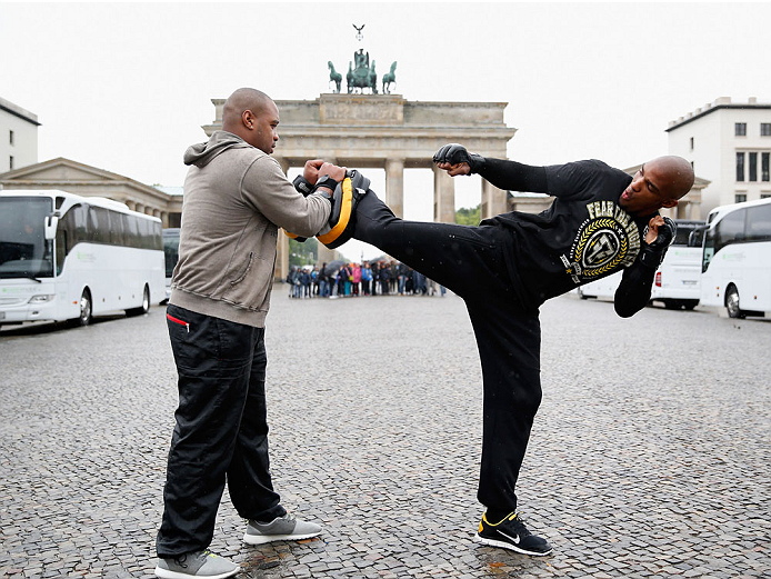 BERLIN, GERMANY - MAY 28: Francis Carmont (R) holds a Guerillia open air training session for fans and media at Brandenburg Gate on May 28, 2014 in Berlin, Germany. (Photo by Boris Streubel/Zuffa LLC/Zuffa LLC via Getty Images)