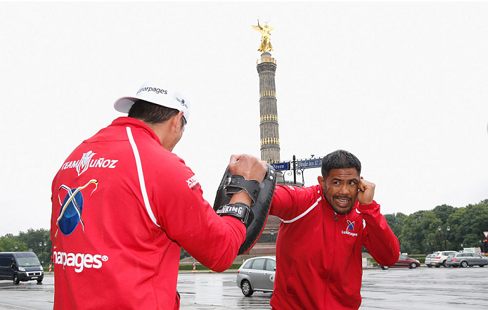 BERLIN, GERMANY - MAY 28: Mark Munoz (R) holds a Guerillia open air training session for fans and media at Victoria Statue on May 28, 2014 in Berlin, Germany. (Photo by Boris Streubel/Zuffa LLC/Zuffa LLC via Getty Images)