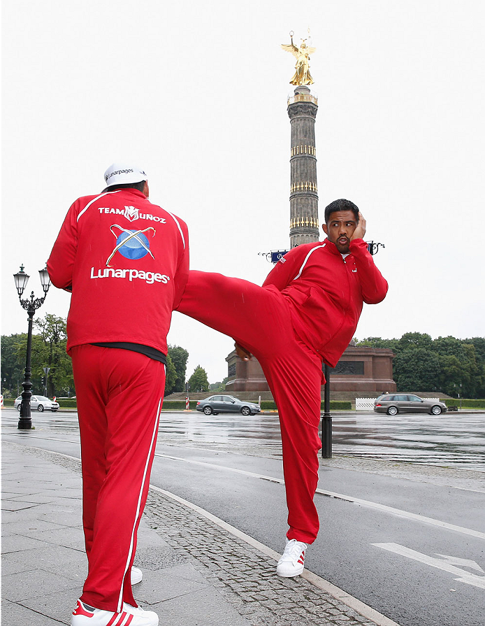 BERLIN, GERMANY - MAY 28: Mark Munoz (R) holds a Guerillia open air training session for fans and media at Victoria Statue on May 28, 2014 in Berlin, Germany. (Photo by Boris Streubel/Zuffa LLC/Zuffa LLC via Getty Images)
