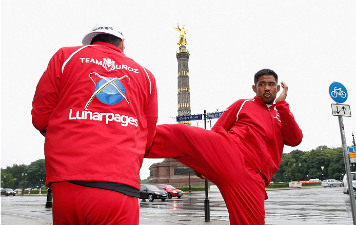 BERLIN, GERMANY - MAY 28: Mark Munoz (R) holds a Guerillia open air training session for fans and media at Victoria Statue on May 28, 2014 in Berlin, Germany. (Photo by Boris Streubel/Zuffa LLC/Zuffa LLC via Getty Images)