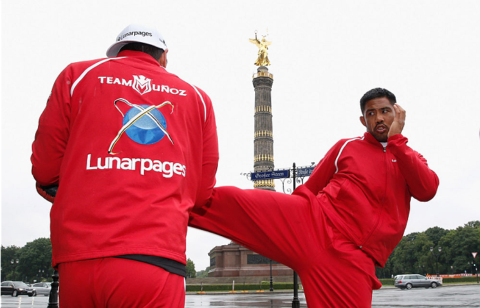 BERLIN, GERMANY - MAY 28: Mark Munoz (R) holds a Guerillia open air training session for fans and media at Victoria Statue on May 28, 2014 in Berlin, Germany. (Photo by Boris Streubel/Zuffa LLC/Zuffa LLC via Getty Images)