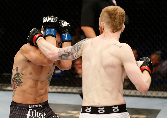 DUBLIN, IRELAND - JULY 19: (R-L) Patrick Holohan lands a left against Josh Sampo in their flyweight bout during the UFC Fight Night event at The O2 Dublin on July 19, 2014 in Dublin, Ireland. (Photo by Josh Hedges/Zuffa LLC/Zuffa LLC via Getty Images)
