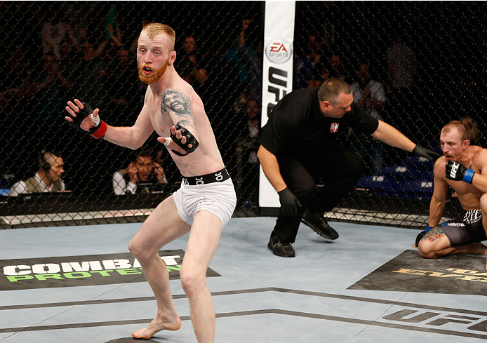 DUBLIN, IRELAND - JULY 19: Patrick Holohan celebrates after his submission victory over Josh Sampo in their flyweight bout during the UFC Fight Night event at The O2 Dublin on July 19, 2014 in Dublin, Ireland. (Photo by Josh Hedges/Zuffa LLC/Zuffa LLC v
