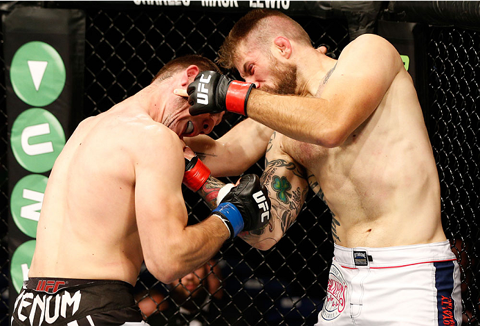 DUBLIN, IRELAND - JULY 19: (R-L) Cody Donovan connects with a right uppercut against Nikita Krylov in their light heavyweight bout during the UFC Fight Night event at The O2 Dublin on July 19, 2014 in Dublin, Ireland. (Photo by Josh Hedges/Zuffa LLC/Zuf