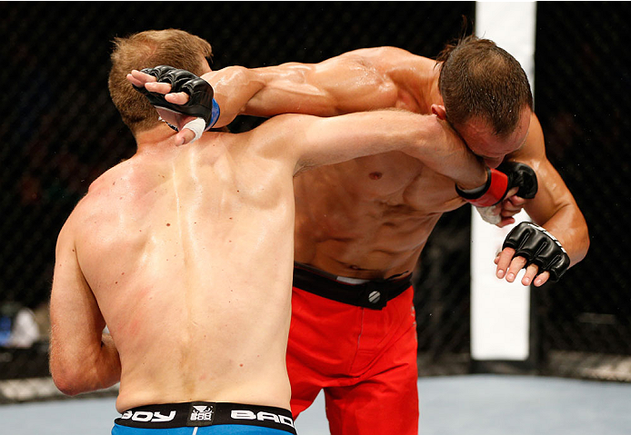 DUBLIN, IRELAND - JULY 19: (L-R) Tor Troeng connects with a right to the head of Trevor Smith in their middleweight bout during the UFC Fight Night event at The O2 Dublin on July 19, 2014 in Dublin, Ireland. (Photo by Josh Hedges/Zuffa LLC/Zuffa LLC via