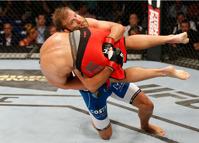 DUBLIN, IRELAND - JULY 19: Tor Troeng (blue trunks) takes down Trevor Smith in their middleweight bout during the UFC Fight Night event at The O2 Dublin on July 19, 2014 in Dublin, Ireland. (Photo by Josh Hedges/Zuffa LLC/Zuffa LLC via Getty Images)