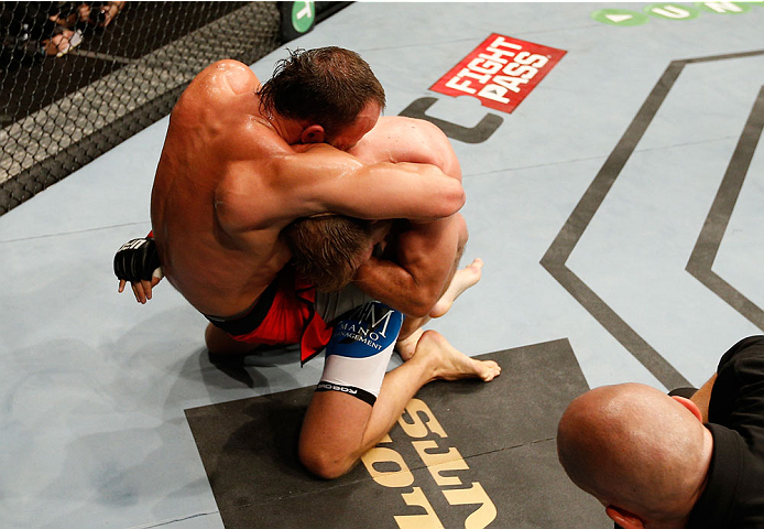 DUBLIN, IRELAND - JULY 19: (L-R) Trevor Smith attempts to secure a guillotine choke submission against Tor Troeng in their middleweight bout during the UFC Fight Night event at The O2 Dublin on July 19, 2014 in Dublin, Ireland. (Photo by Josh Hedges/Zuf