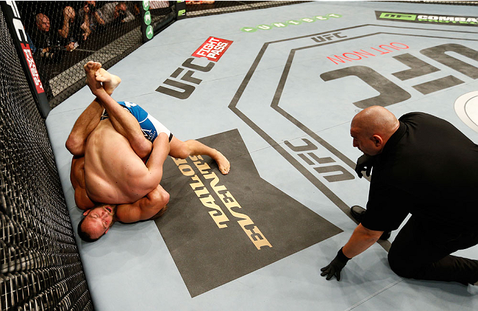DUBLIN, IRELAND - JULY 19: (L-R) Trevor Smith attempts to secure a guillotine choke submission against Tor Troeng in their middleweight bout during the UFC Fight Night event at The O2 Dublin on July 19, 2014 in Dublin, Ireland. (Photo by Josh Hedges/Zuf