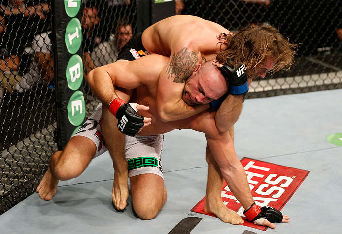 DUBLIN, IRELAND - JULY 19: (R-L) Mike King attempts to secure a rear choke submission against Mike King in their middleweight bout during the UFC Fight Night event at The O2 Dublin on July 19, 2014 in Dublin, Ireland. (Photo by Josh Hedges/Zuffa LLC/Zuf