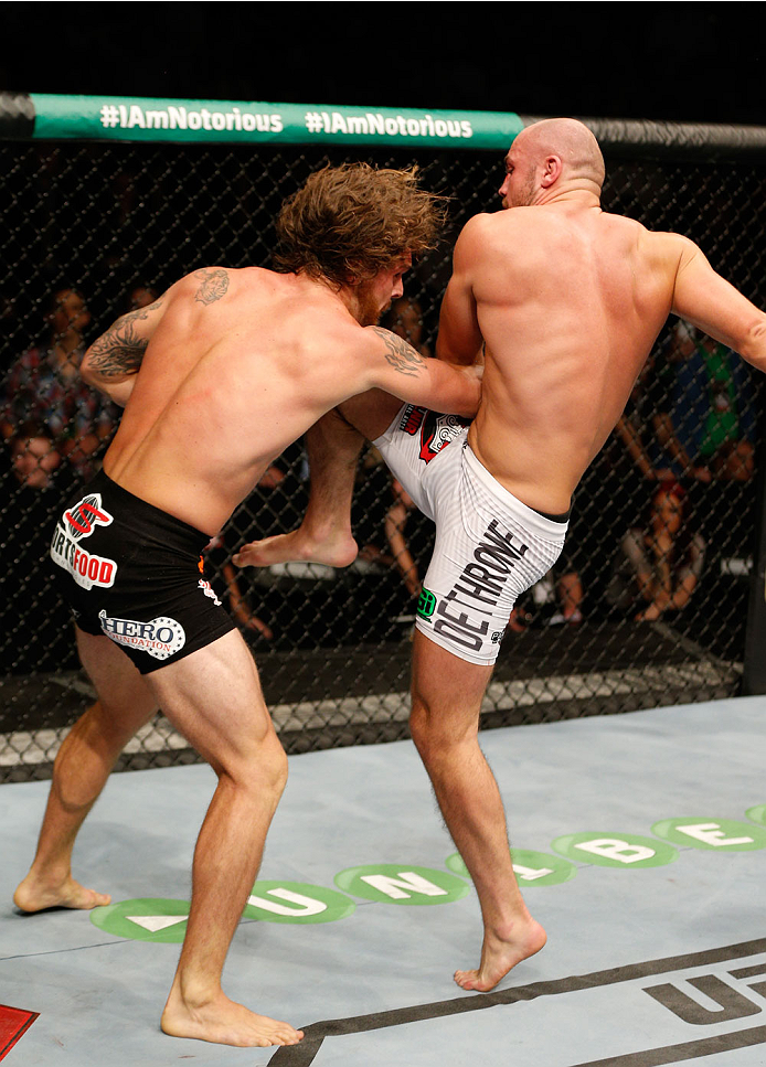 DUBLIN, IRELAND - JULY 19: (R-L) Cathal Pendred of Dublin lands a knee to the head of Mike King in their middleweight bout during the UFC Fight Night event at The O2 Dublin on July 19, 2014 in Dublin, Ireland. (Photo by Josh Hedges/Zuffa LLC/Zuffa LLC v