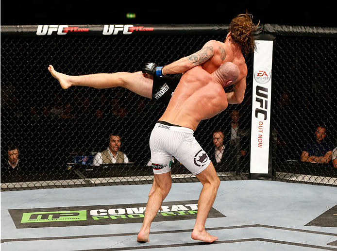 DUBLIN, IRELAND - JULY 19: (L-R) Cathal Pendred takes down Mike King in their middleweight bout during the UFC Fight Night event at The O2 Dublin on July 19, 2014 in Dublin, Ireland. (Photo by Josh Hedges/Zuffa LLC/Zuffa LLC via Getty Images)