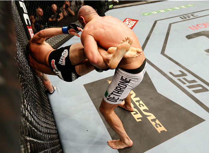 DUBLIN, IRELAND - JULY 19: (R-L) Cathal Pendred of Dublin takes down Mike King in their middleweight bout during the UFC Fight Night event at The O2 Dublin on July 19, 2014 in Dublin, Ireland. (Photo by Josh Hedges/Zuffa LLC/Zuffa LLC via Getty Images)