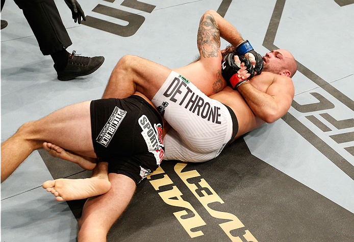 DUBLIN, IRELAND - JULY 19: (R-L) Cathal Pendred secures a rear choke submission against Mike King in their middleweight bout during the UFC Fight Night event at The O2 Dublin on July 19, 2014 in Dublin, Ireland. (Photo by Josh Hedges/Zuffa LLC/Zuffa LLC