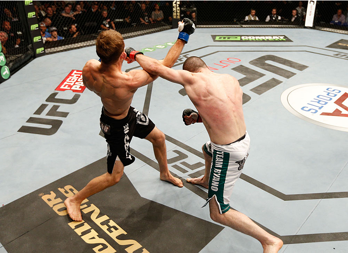 DUBLIN, IRELAND - JULY 19: (R-L) Neil Seery and Phil Harris trade punches in their flyweight bout during the UFC Fight Night event at The O2 Dublin on July 19, 2014 in Dublin, Ireland. (Photo by Josh Hedges/Zuffa LLC/Zuffa LLC via Getty Images)