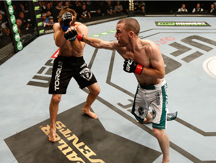 DUBLIN, IRELAND - JULY 19: (R-L) Neil Seery connects with a right against Phil Harris in their flyweight bout during the UFC Fight Night event at The O2 Dublin on July 19, 2014 in Dublin, Ireland. (Photo by Josh Hedges/Zuffa LLC/Zuffa LLC via Getty Imag