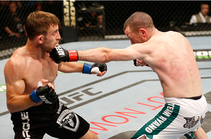 DUBLIN, IRELAND - JULY 19: (R-L) Neil Seery connects with a left against Phil Harris in their flyweight bout during the UFC Fight Night event at The O2 Dublin on July 19, 2014 in Dublin, Ireland. (Photo by Josh Hedges/Zuffa LLC/Zuffa LLC via Getty Image