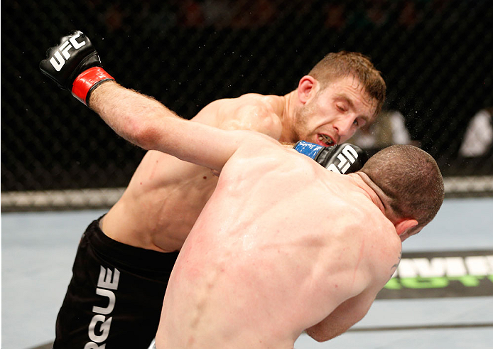 DUBLIN, IRELAND - JULY 19: (L-R) Phil Harris connects with a left against Neil Seery in their flyweight bout during the UFC Fight Night event at The O2 Dublin on July 19, 2014 in Dublin, Ireland. (Photo by Josh Hedges/Zuffa LLC/Zuffa LLC via Getty Image