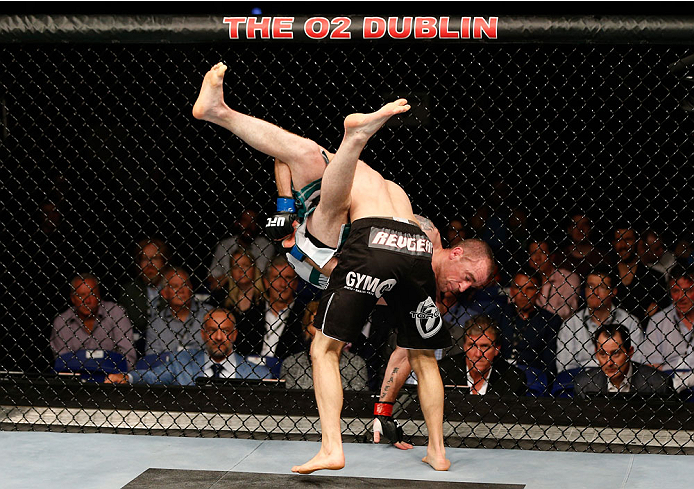 DUBLIN, IRELAND - JULY 19: Phil Harris (black trunks) takes down Neil Seery in their flyweight bout during the UFC Fight Night event at The O2 Dublin on July 19, 2014 in Dublin, Ireland. (Photo by Josh Hedges/Zuffa LLC/Zuffa LLC via Getty Images)