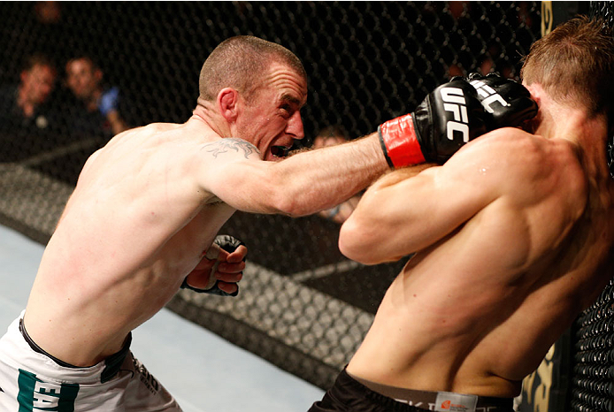 DUBLIN, IRELAND - JULY 19: (L-R) Neil Seery connects with a right against Phil Harris in their flyweight bout during the UFC Fight Night event at The O2 Dublin on July 19, 2014 in Dublin, Ireland. (Photo by Josh Hedges/Zuffa LLC/Zuffa LLC via Getty Imag