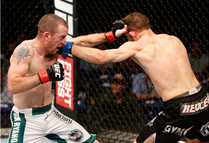 DUBLIN, IRELAND - JULY 19: (L-R) Neil Seery and Phil Harris trade punches in their flyweight bout during the UFC Fight Night event at The O2 Dublin on July 19, 2014 in Dublin, Ireland. (Photo by Josh Hedges/Zuffa LLC/Zuffa LLC via Getty Images)