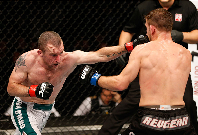 DUBLIN, IRELAND - JULY 19: (L-R) Neil Seery connects with a left against Phil Harris in their flyweight bout during the UFC Fight Night event at The O2 Dublin on July 19, 2014 in Dublin, Ireland. (Photo by Josh Hedges/Zuffa LLC/Zuffa LLC via Getty Image