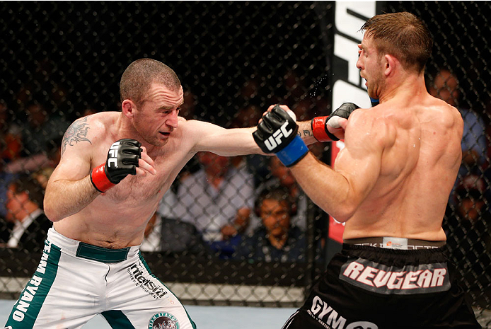 DUBLIN, IRELAND - JULY 19: (L-R) Neil Seery connects with a left against Phil Harris in their flyweight bout during the UFC Fight Night event at The O2 Dublin on July 19, 2014 in Dublin, Ireland. (Photo by Josh Hedges/Zuffa LLC/Zuffa LLC via Getty Image