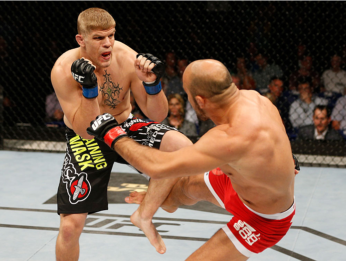 DUBLIN, IRELAND - JULY 19: (L-R) Chris Dempsey checks a punishing leg kick from Ilir Latifi in their light heavyweight bout during the UFC Fight Night event at The O2 Dublin on July 19, 2014 in Dublin, Ireland. (Photo by Josh Hedges/Zuffa LLC/Zuffa LLC