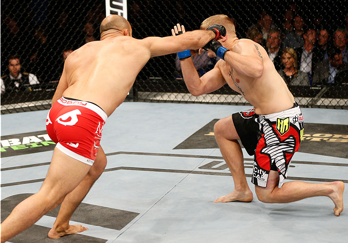 DUBLIN, IRELAND - JULY 19: (L-R) Ilir Latifi lands a right to the head of Chris Dempsey in their light heavyweight bout during the UFC Fight Night event at The O2 Dublin on July 19, 2014 in Dublin, Ireland. (Photo by Josh Hedges/Zuffa LLC/Zuffa LLC via