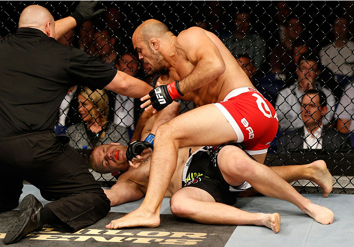 DUBLIN, IRELAND - JULY 19: (R-L) Ilir Latifi secures a TKO victory over Chris Dempsey with a series of punches in their light heavyweight bout during the UFC Fight Night event at The O2 Dublin on July 19, 2014 in Dublin, Ireland. (Photo by Josh Hedges/Z