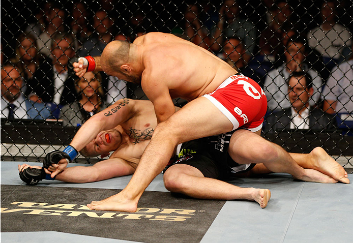 DUBLIN, IRELAND - JULY 19: (R-L) Ilir Latifi secures a TKO victory over Chris Dempsey with a series of punches in their light heavyweight bout during the UFC Fight Night event at The O2 Dublin on July 19, 2014 in Dublin, Ireland. (Photo by Josh Hedges/Z