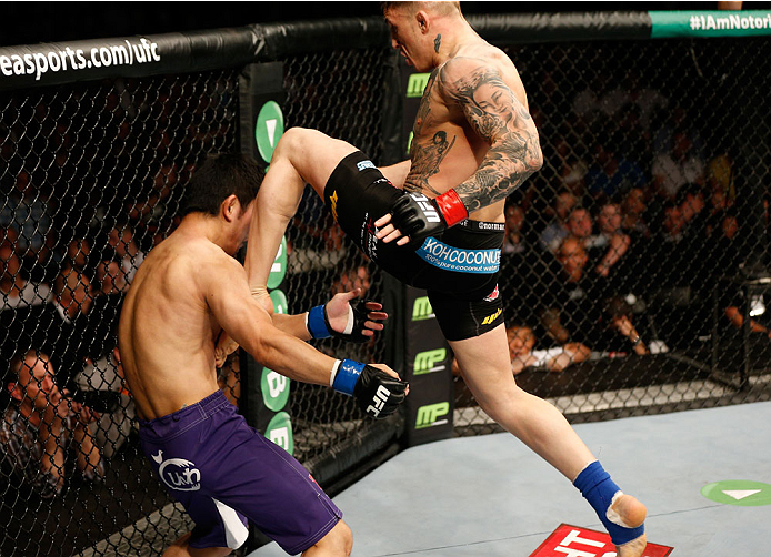 DUBLIN, IRELAND - JULY 19: (R-L) Norman Parke delivers a flying knee against Naoyuki Kotani in their lightweight bout during the UFC Fight Night event at The O2 Dublin on July 19, 2014 in Dublin, Ireland. (Photo by Josh Hedges/Zuffa LLC/Zuffa LLC via Ge