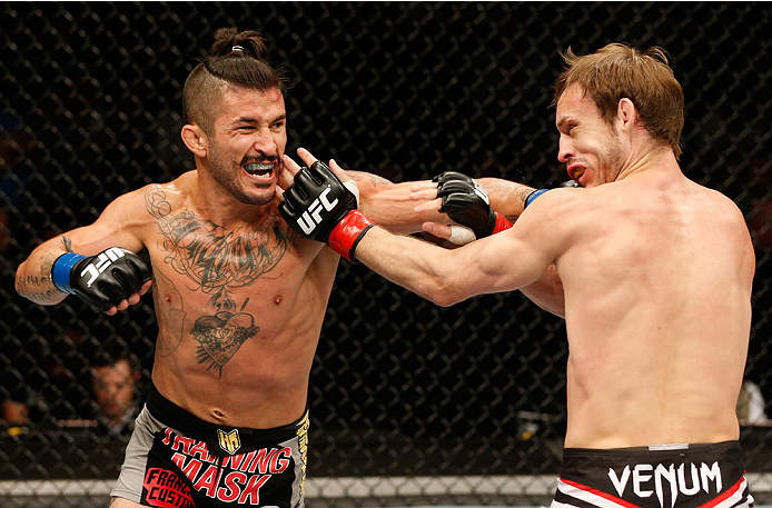 DUBLIN, IRELAND - JULY 19: (L-R) Ian McCall connects with a left against Brad Pickett in their flyweight bout during the UFC Fight Night event at The O2 Dublin on July 19, 2014 in Dublin, Ireland. (Photo by Josh Hedges/Zuffa LLC/Zuffa LLC via Getty Imag
