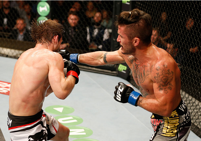 DUBLIN, IRELAND - JULY 19: (R-L) Ian McCall connects with a right against Brad Pickett in their flyweight bout during the UFC Fight Night event at The O2 Dublin on July 19, 2014 in Dublin, Ireland. (Photo by Josh Hedges/Zuffa LLC/Zuffa LLC via Getty Ima